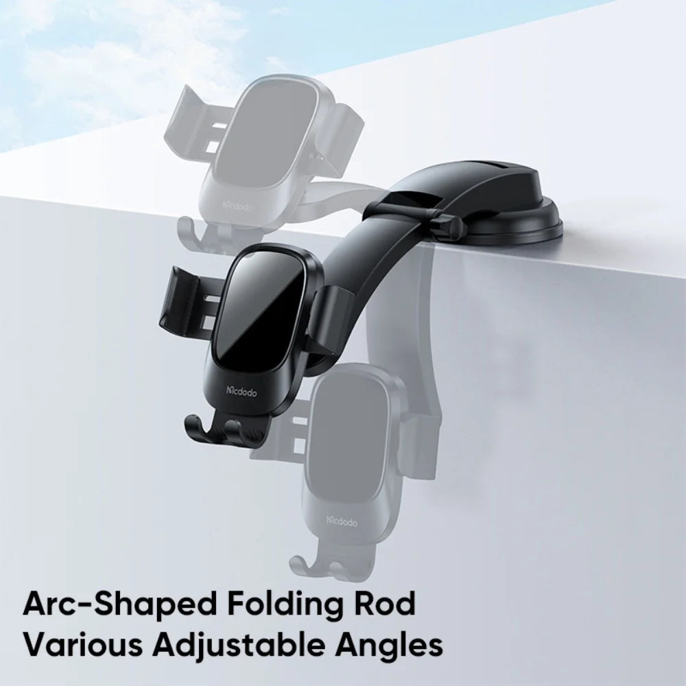 Mcdodo CM-7220 universal car phone holder mounted on car dashboard holding a smartphone securely